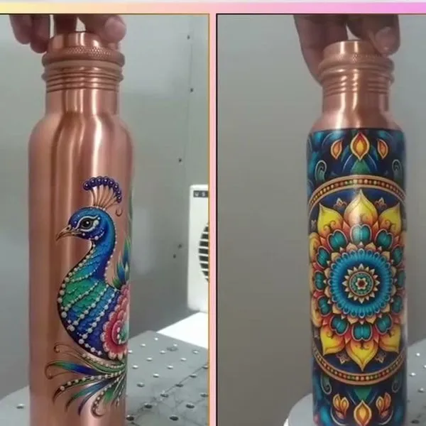 Two copper bottles with peacock and mandala artwork