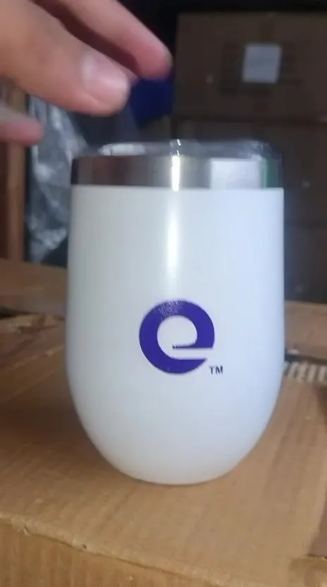 White tumbler branded with the Expedia logo