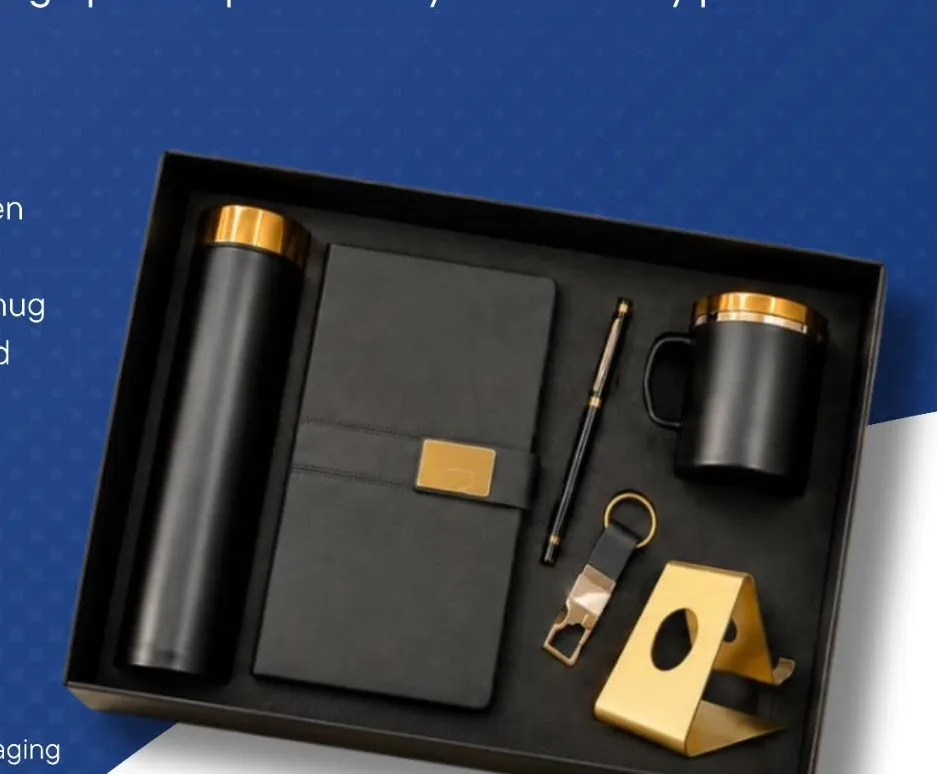 Black and gold gift set with bottle, notebook, pen, keychain, mug and mobile stand