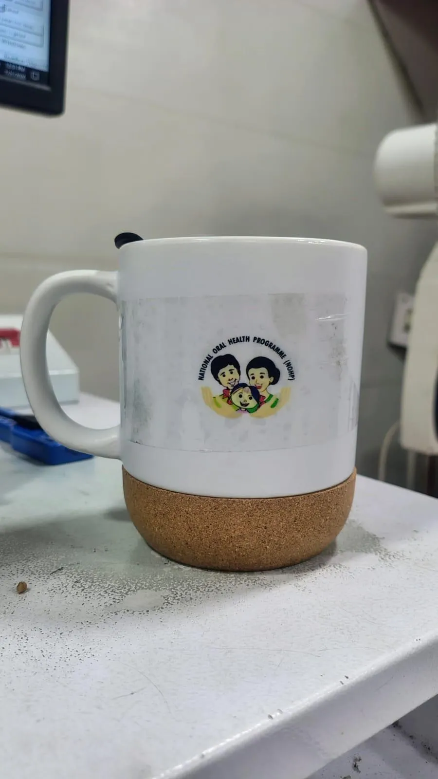White mug with a cork base carrying a full-colour UV DTF logo